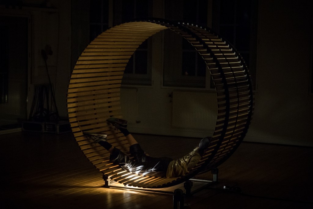 Artist Joey Schrauwen inside a giant wheel